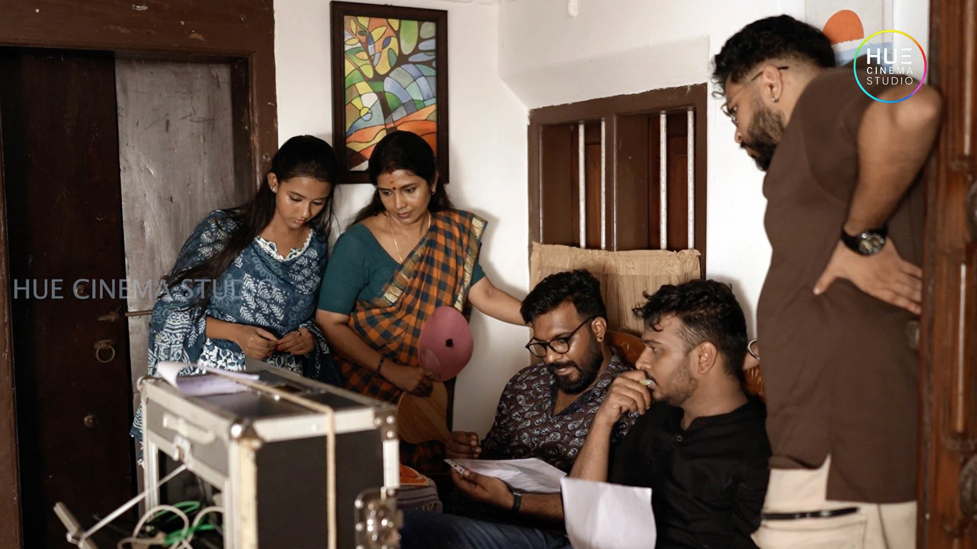 Director Haran Reddi with actresses Letha Das and Diya Deepan reviewing a shot on the monitor during the Jolsiyan ad film shoot, Hue Cinema Studio.