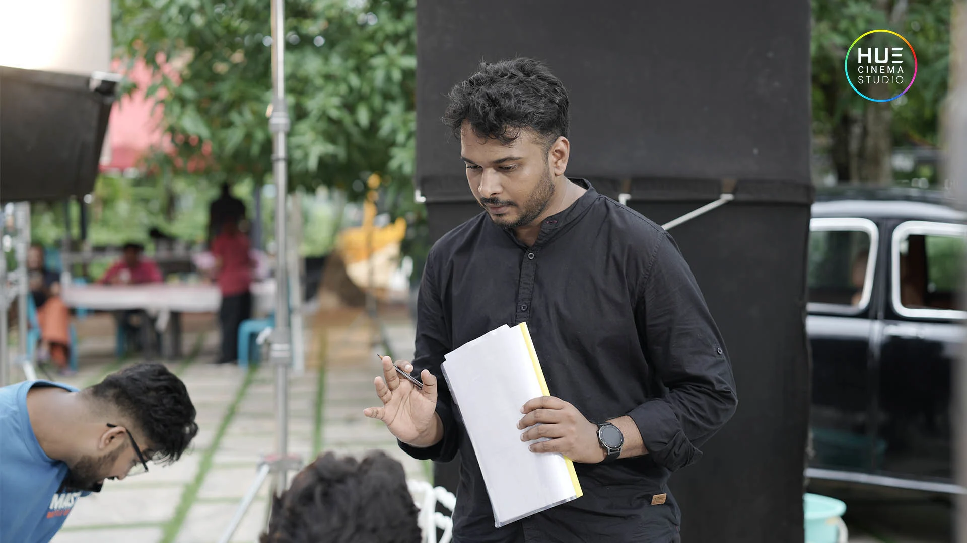 Director Haran Reddi monitoring shots on the set of Turning Point, an ad film production by Hue Cinema Studio in Kerala.